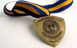 photo of the SUNY Awards medal on a white tabletop